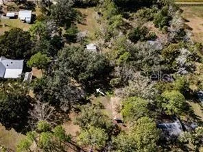 a view of a house with a tree