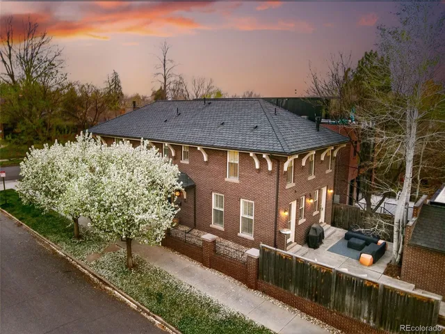 a view of a house with a yard and sitting area
