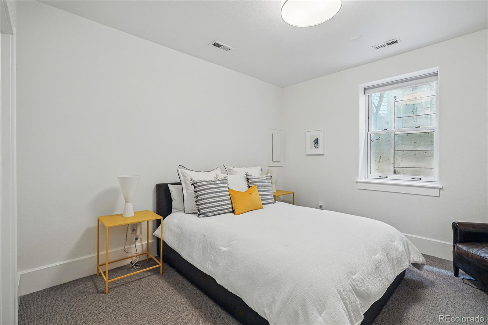 201 South Lafayette Street Denver, CO 80209 - Photo 31 of 48 a bedroom with a bed and wooden floor