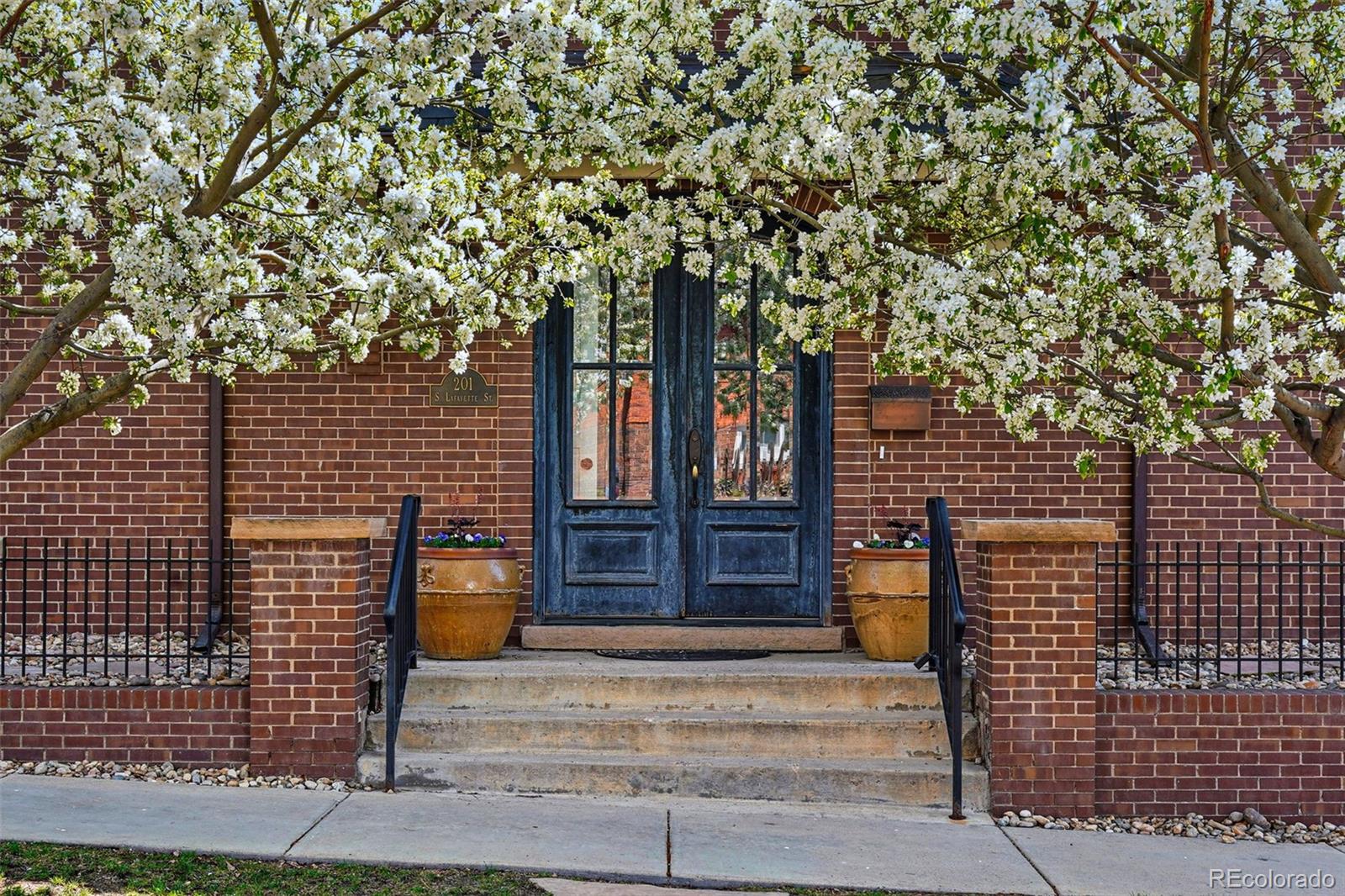201 South Lafayette Street Denver, CO 80209 - Photo 5 of 48 a front view of a house with a tree