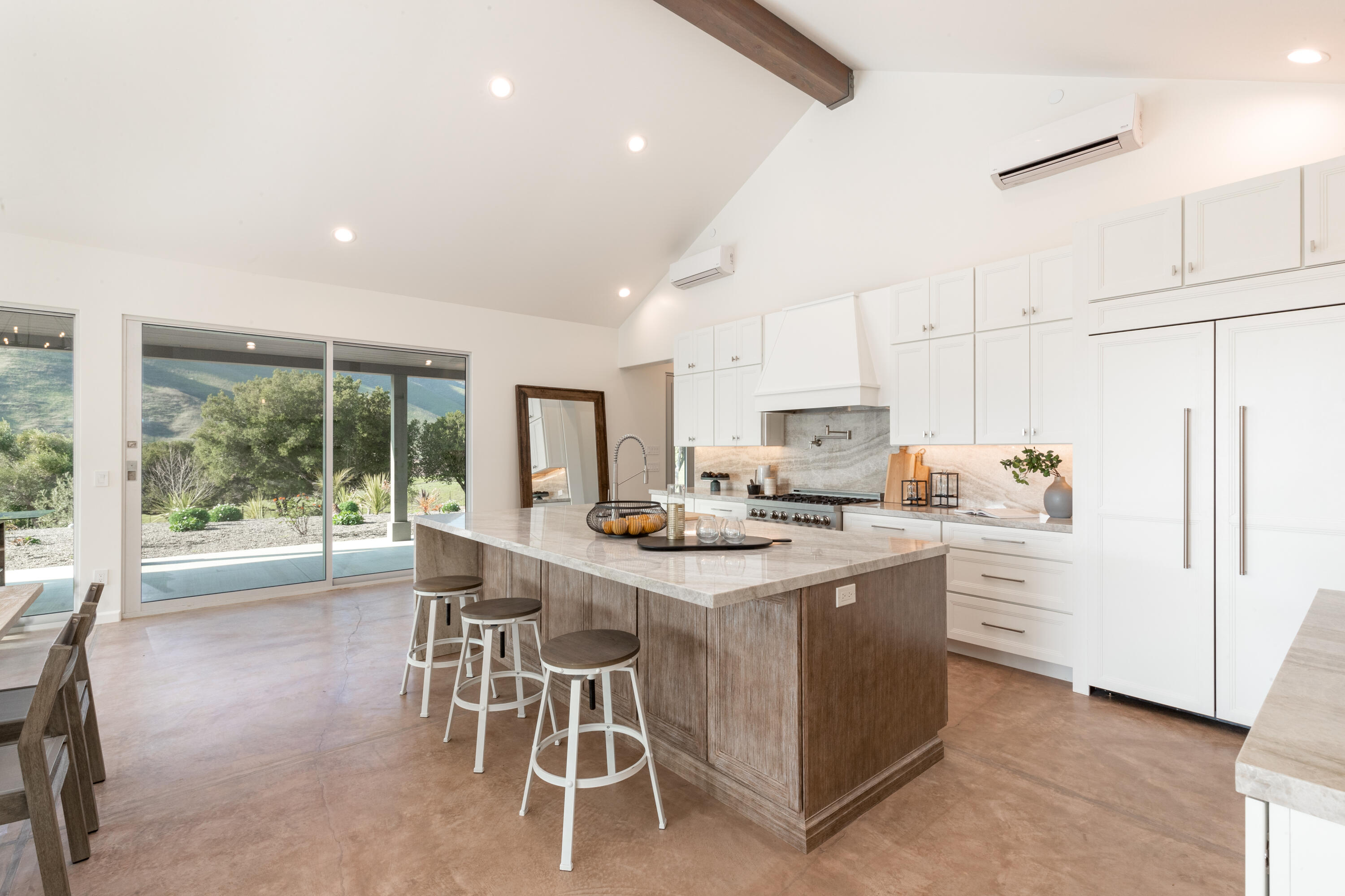 119 Hollister Ranch Road, Unit 1 Goleta, CA 93117 - Photo 8 of 41 a kitchen with stainless steel appliances kitchen island granite countertop a sink and cabinets