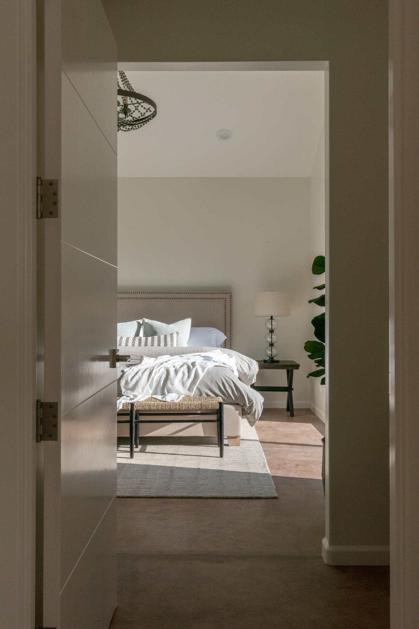 119 Hollister Ranch Road, Unit 1 Goleta, CA 93117 - Photo 9 of 41 a bed sitting in a bedroom next to a bathroom with a sink and a mirror