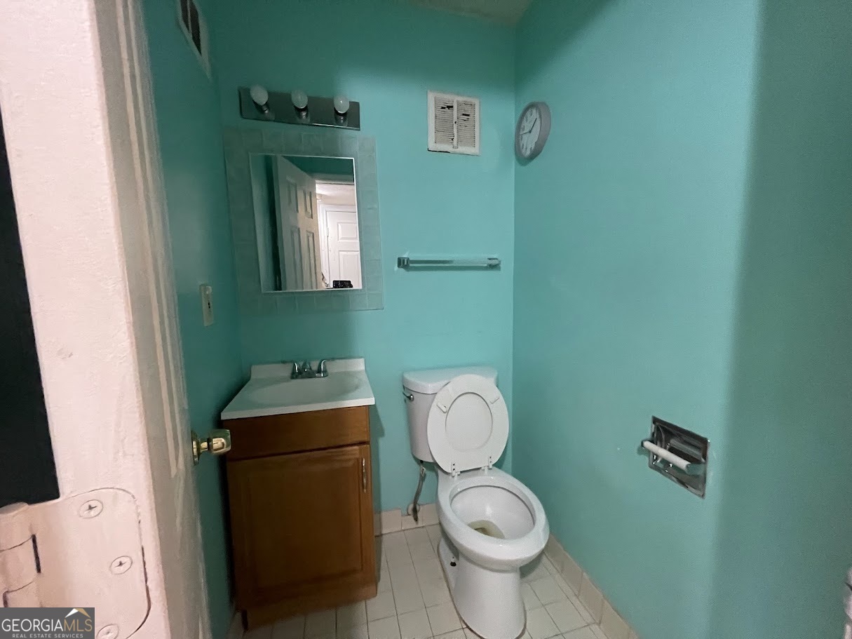 1625 Conley Road, Unit 254 Conley, GA 30288 - Photo 3 of 10 a bathroom with a toilet and a sink