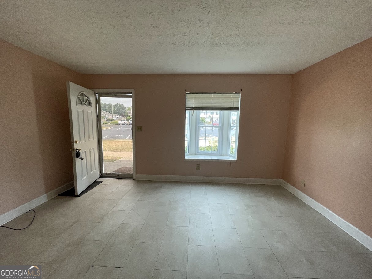 1625 Conley Road, Unit 254 Conley, GA 30288 - Photo 4 of 10 an empty room with windows