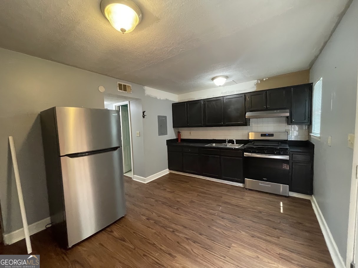 1625 Conley Road, Unit 254 Conley, GA 30288 - Photo 6 of 10 a kitchen with a refrigerator and a microwave