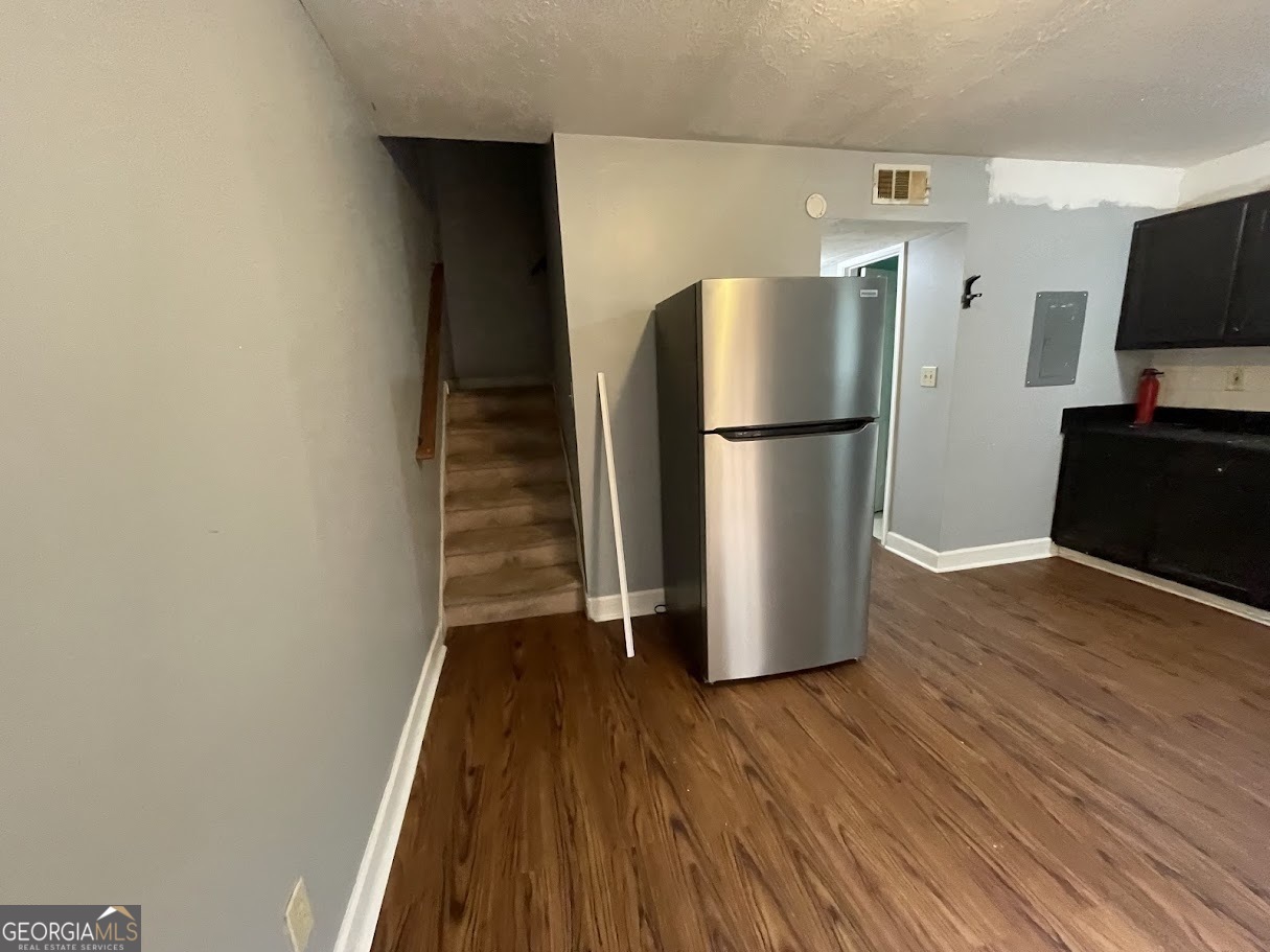 1625 Conley Road, Unit 254 Conley, GA 30288 - Photo 7 of 10 a view of a kitchen with wooden floor and a refrigerator