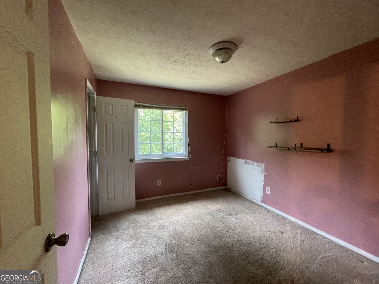 1625 Conley Road, Unit 254 Conley, GA 30288 - Photo 8 of 10 an empty room with windows