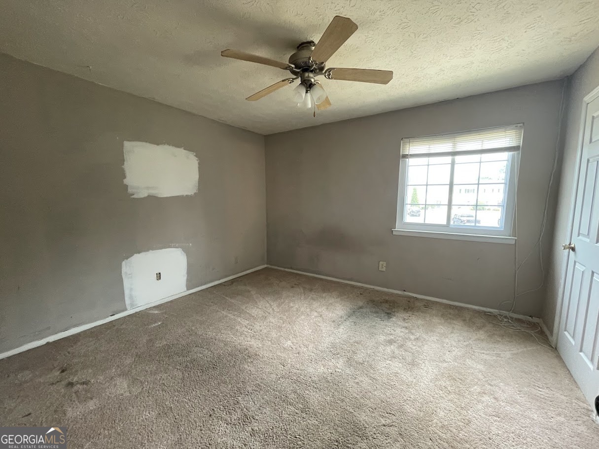 1625 Conley Road, Unit 254 Conley, GA 30288 - Photo 9 of 10 a view of an empty room with a window