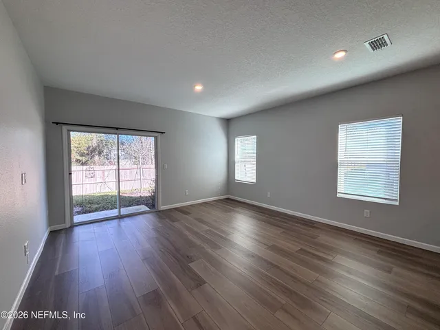 a view of kitchen with wooden floor and window