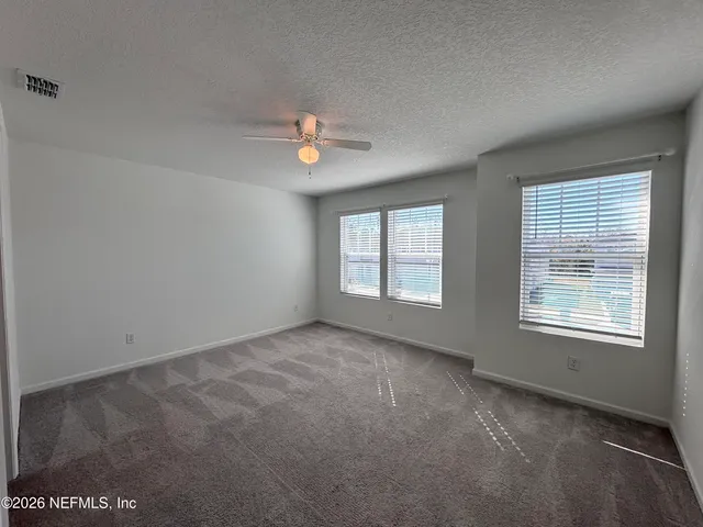 a bathroom with a sink toilet vanity and shower