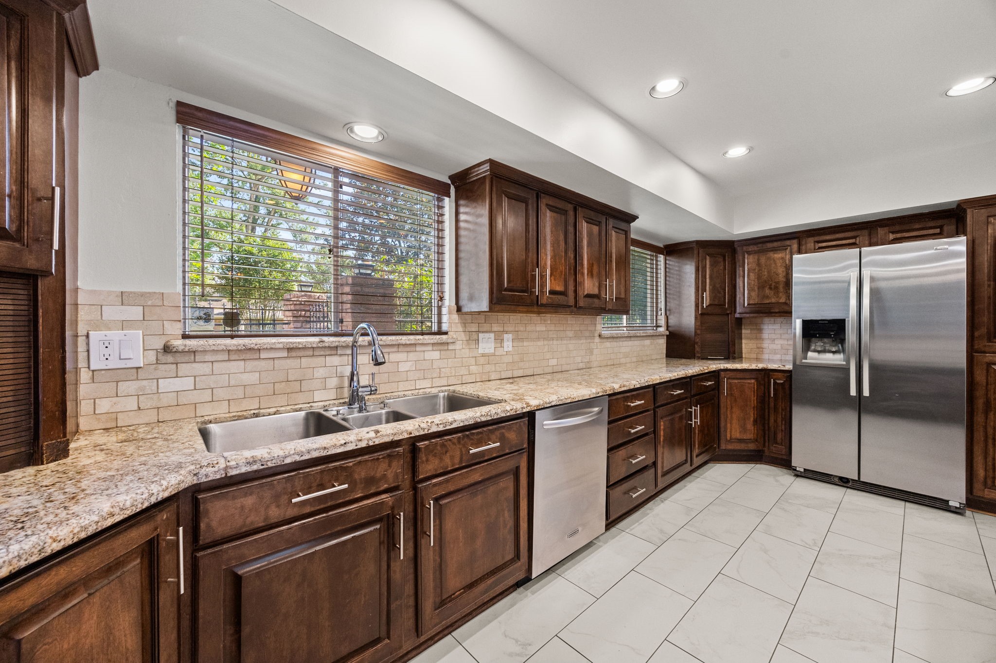 10310 Mayfield Road Houston, TX 77043 - Photo 24 of 49 Kitchen features recessed lights and stainless appliances