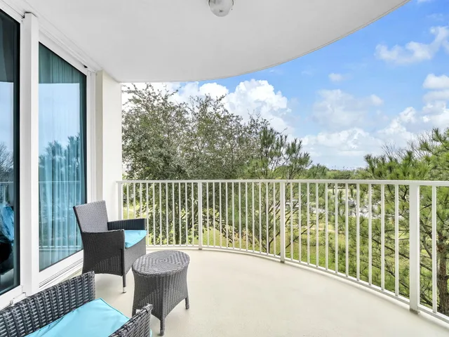 a view of a chair and table in the balcony