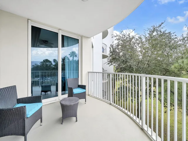 a view of a balcony with furniture