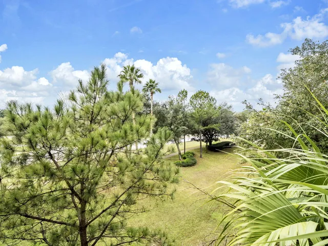 a swimming pool with trees in the background