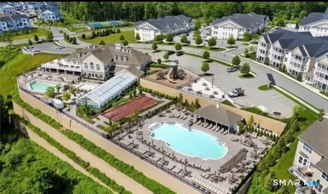 an aerial view of a house with outdoor space pool patio and outdoor seating