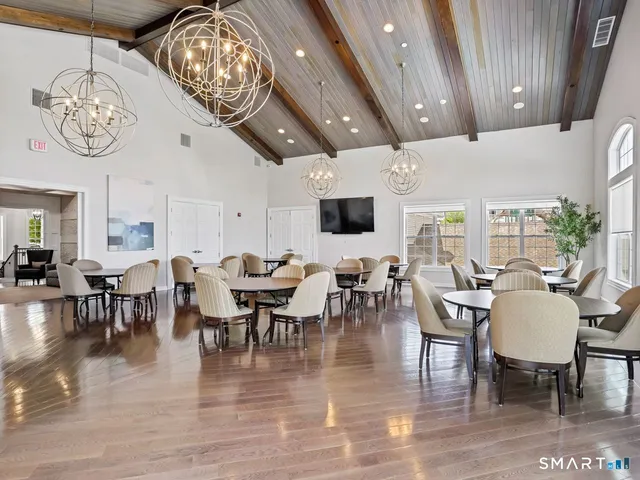 a view of a dining room with furniture window and outside view