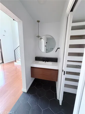 a view of entryway and hall with wooden floor