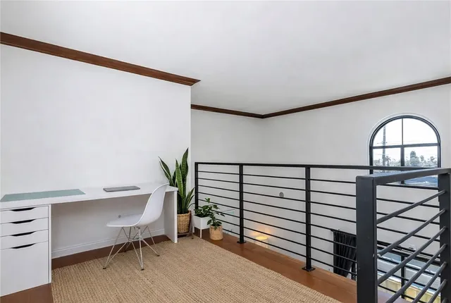 a view of a livingroom with furniture and a window