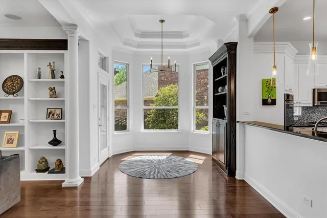 a view of a livingroom with furniture window and wooden floor