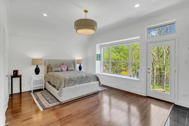 a bedroom with a large bed and a large window