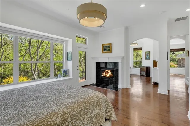 a view of empty room with furniture and a fireplace