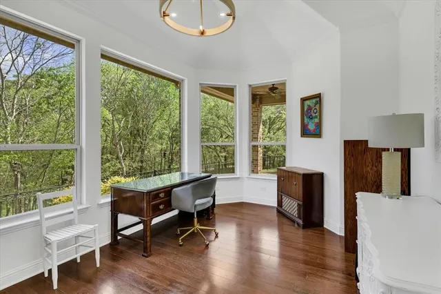 a view of a livingroom with furniture and a window