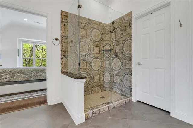 a bathroom with a shower and a sink