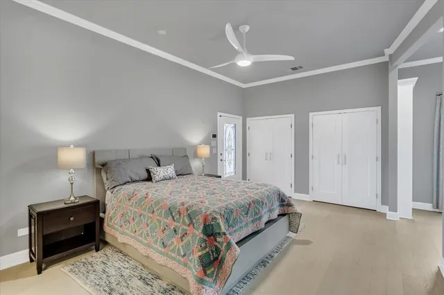 a bedroom with a bed and a dresser