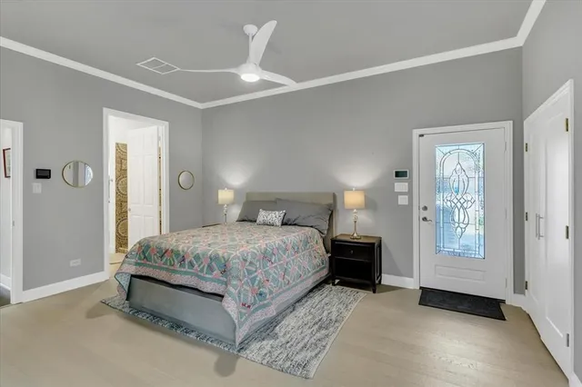 a spacious bedroom with a bed and window