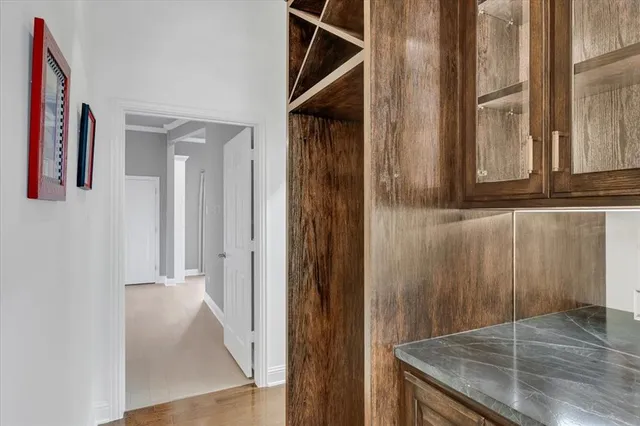 a living room with a furniture and a flat screen tv