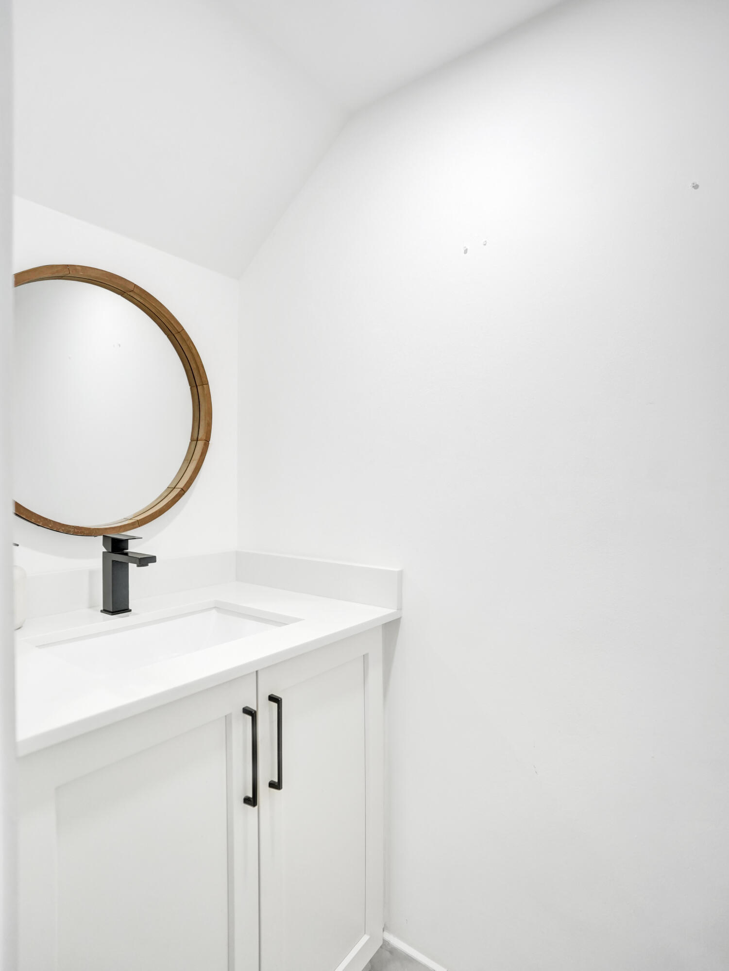 147 Southwest 3rd Street Pompano Beach, FL 33060 - Photo 22 of 29 a bathroom with a sink and a mirror