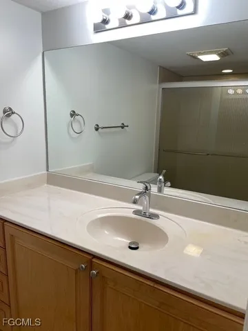 a bathroom with a sink and a mirror