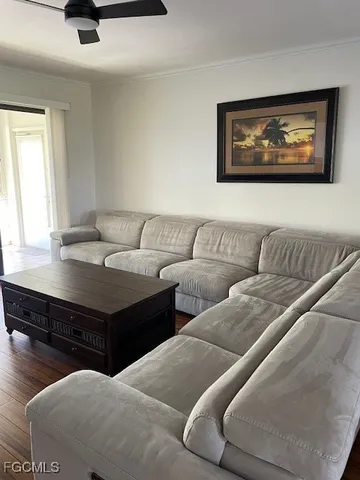 a living room with furniture and a window