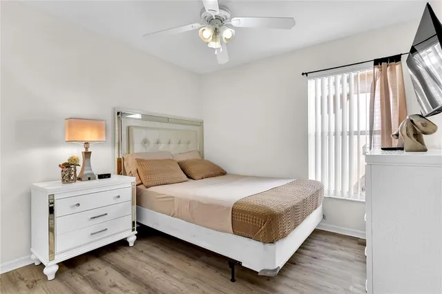 a bedroom with a bed and a dresser