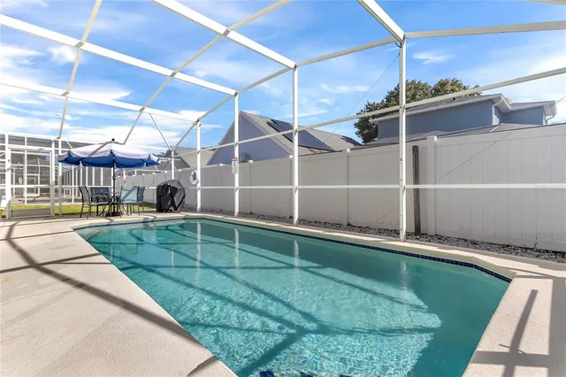 a aerial view of a house with swimming pool