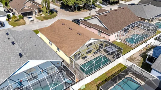 an aerial view of residential houses with outdoor space