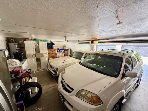 a utility room with furniture and clutter