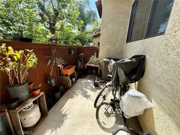 a backyard of a house with table and chairs