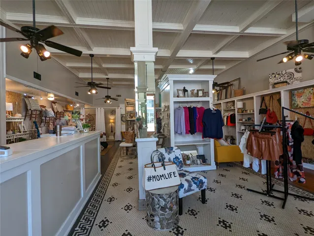 a living room with hardwood floor and furniture