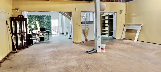 a view of a room with wooden floor