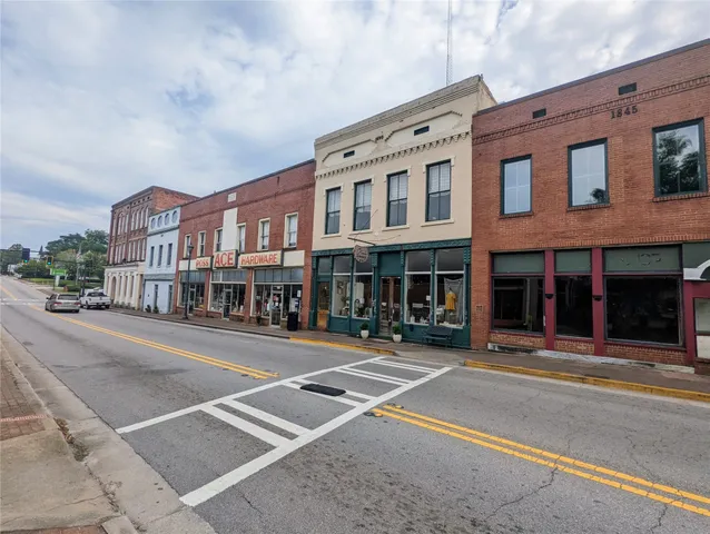a view of a house with a street
