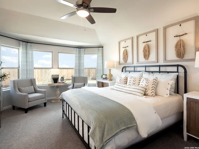 a bedroom with a bed and a couch