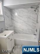 10 Westcott Street Bloomfield, NJ 07003 - Photo 17 of 17 a bathroom with a sink a toilet and shower