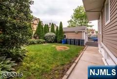 10 Westcott Street Bloomfield, NJ 07003 - Photo 3 of 17 a view of a house with a yard and pathway