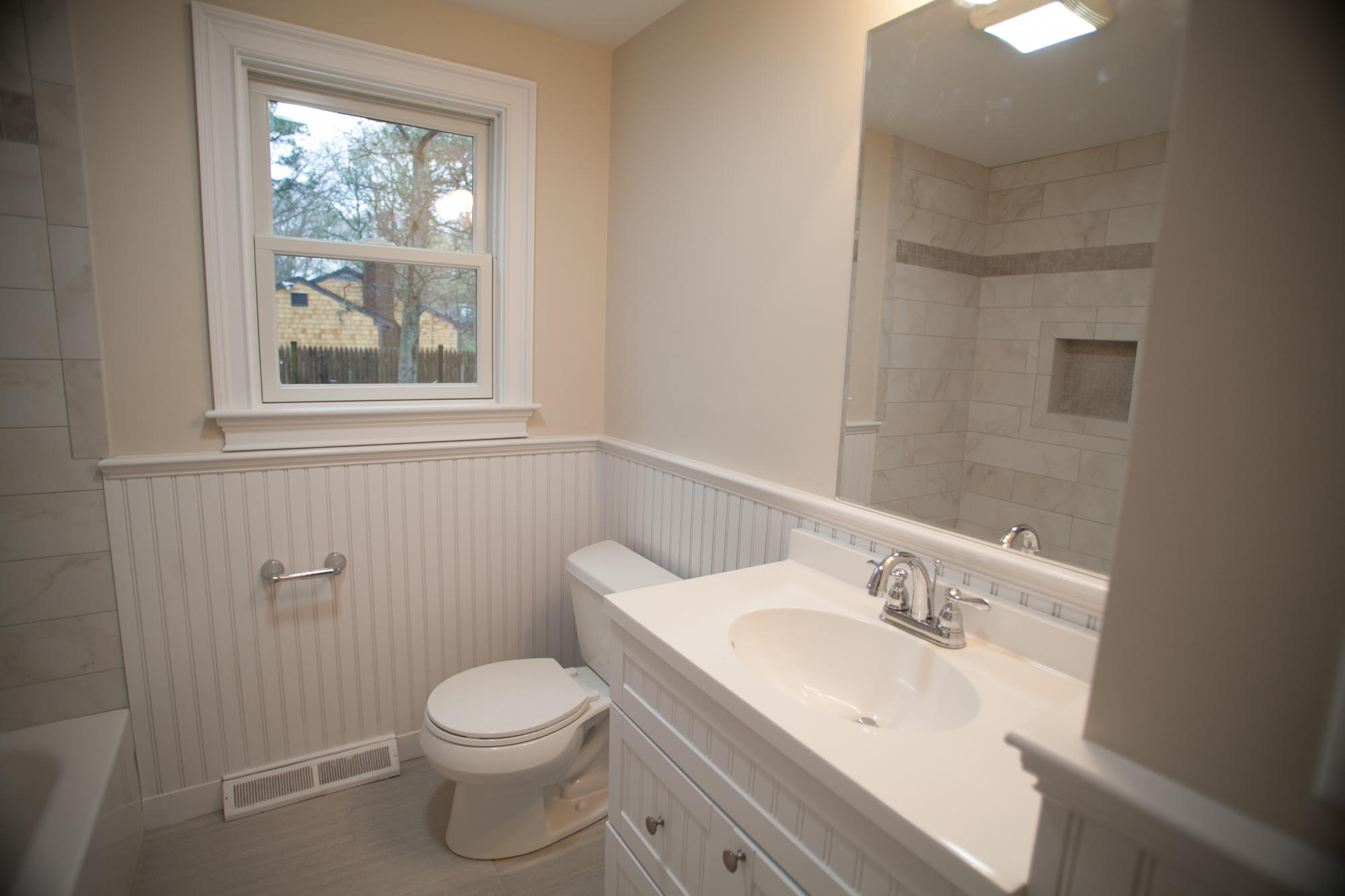 235 Old Craigville Road Hyannis, MA 02601 - Photo 15 of 35 a bathroom with a sink toilet and a window