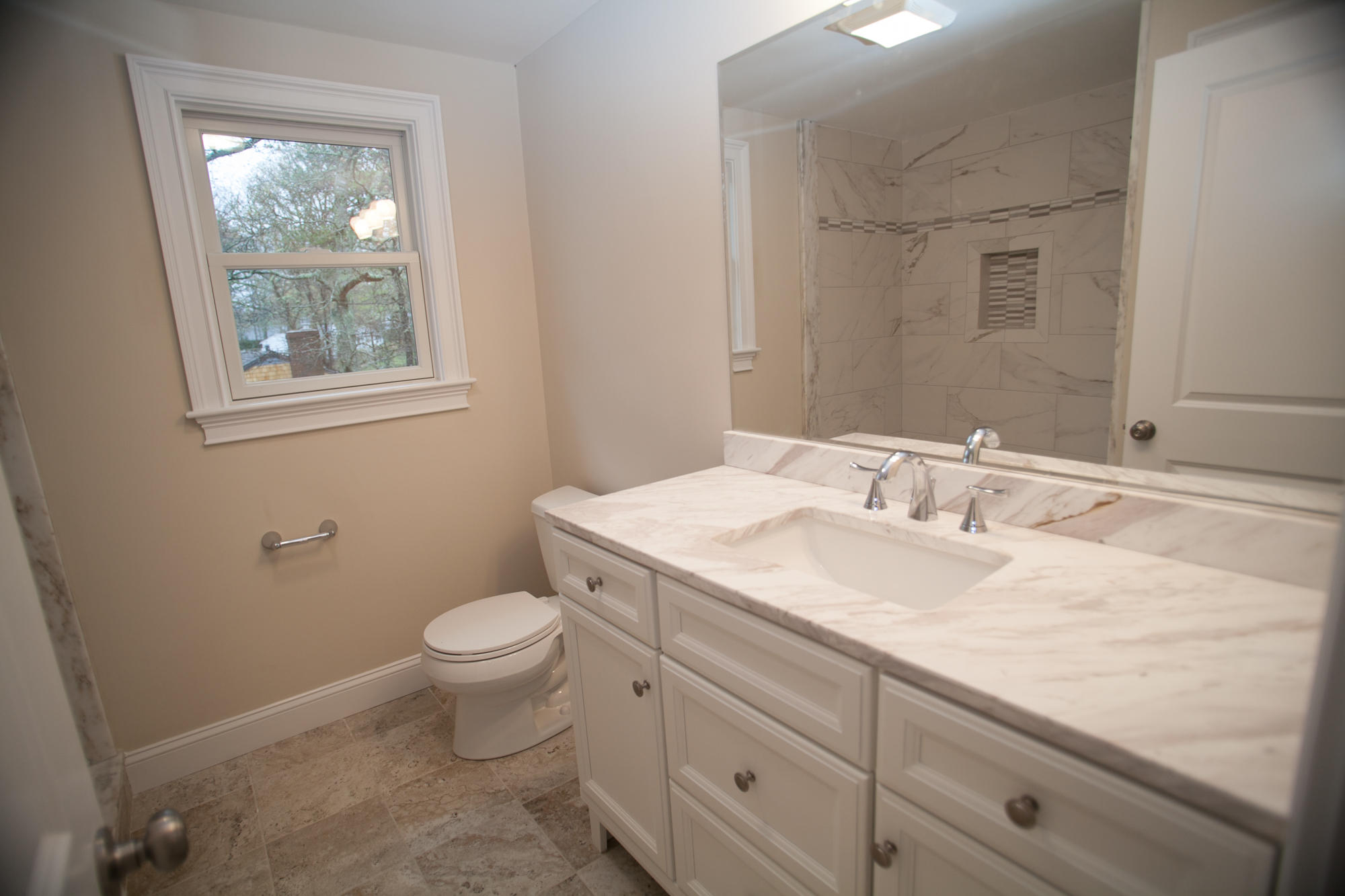 235 Old Craigville Road Hyannis, MA 02601 - Photo 26 of 35 a bathroom with a granite countertop toilet a sink and a window