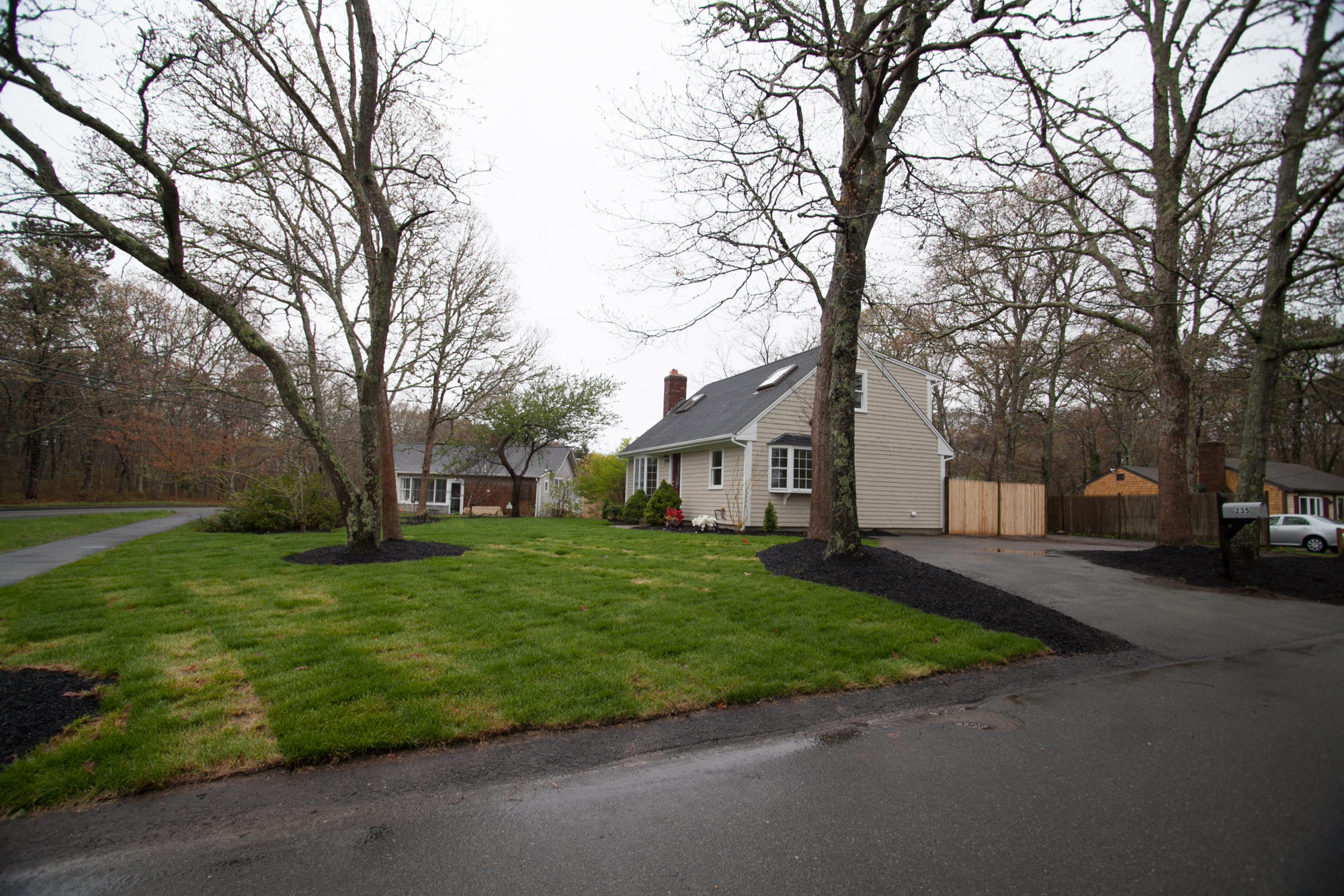 235 Old Craigville Road Hyannis, MA 02601 - Photo 33 of 35 a tree in front of a white house