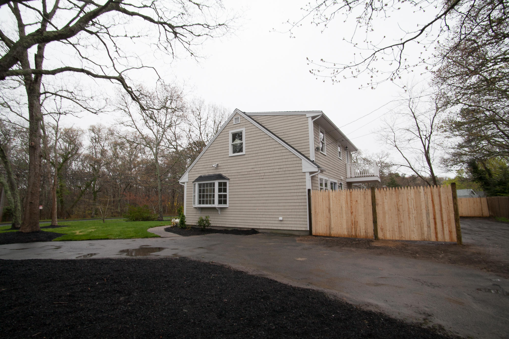 235 Old Craigville Road Hyannis, MA 02601 - Photo 34 of 35 a view of backyard of house with trees