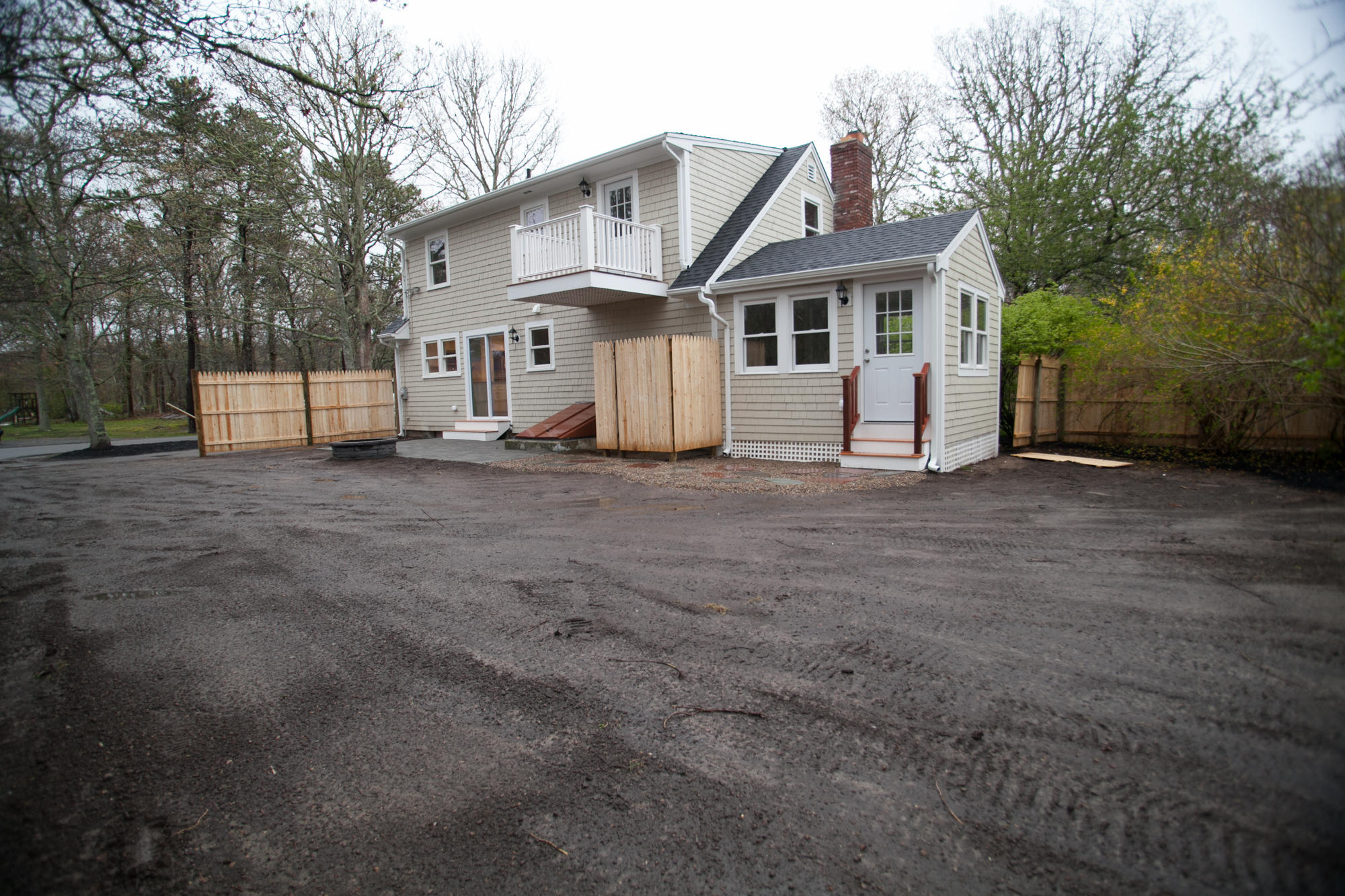235 Old Craigville Road Hyannis, MA 02601 - Photo 35 of 35 a view of a white house with a large tree in front of it