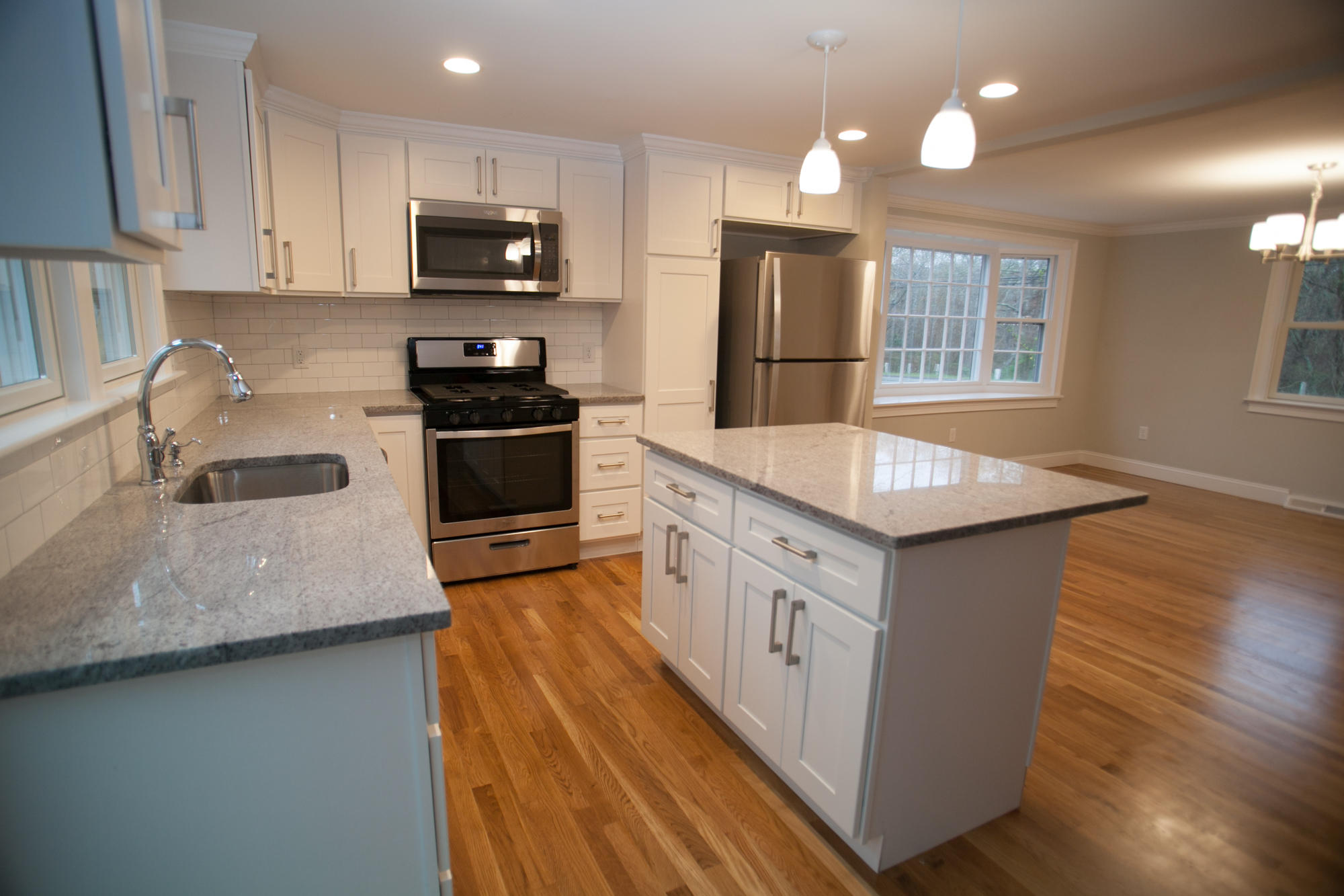 235 Old Craigville Road Hyannis, MA 02601 - Photo 7 of 35 a kitchen with stainless steel appliances kitchen island granite countertop a stove a sink and a refrigerator